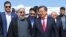 Iranian President Hassan Rohani (front left) and Kyrgyz Prime Minister Jantoro Satybaldiev (front right) ahead of a Bishkek summit 