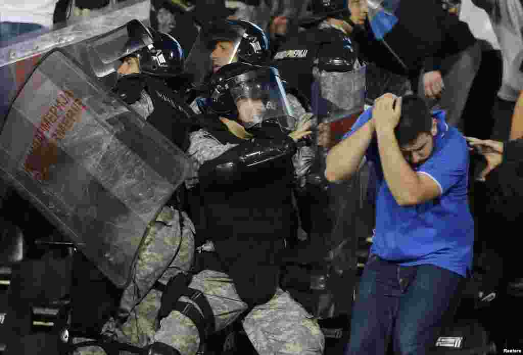 Serbia -- RRiot police clashes with fans during the Euro 2016 Group I qualifying soccer match between Serbia and Albania at the FK Partizan stadium in Belgrade, October 14, 2014