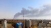 Облако дыма над нефтеперерабатывающим заводом в Байджи, 18 июня 2014