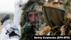 Ukrainian snipers take part in a drill near the village of Stare in the Kyiv region on September 30.