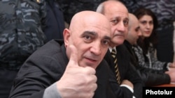 Armenia - Hovannes Tamamian, a police general arrested in March 2011, gestures to a photojournalist at the start of his trial in Yerevan, 16Feb2012.