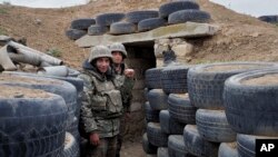 NAGORNO-KARABAKH -- Ethnic Armenian soldiers stand at a fighting position on the frontline, October 21, 2020