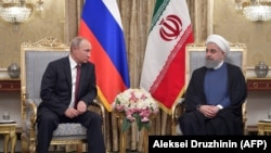  ولادیمیر پوتین، رئیس‌جمهوری روسیه و حسن روحانی همتای ایرانی‌اش در تهران.