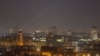 Ukrainian soldiers use searchlights to look for drones in the sky over the city during a Russian strike in Kyiv on March 8.