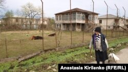 A woman walks in Gali, in Abkhazia.