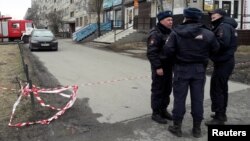 Russian police officers secure a residential area in St. Petersburg on April 6.