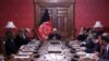 Afghan President Ashraf Ghani (center) talks with U.S. special representative for Afghan peace and reconciliation, Zalmay Khalilzad (upper left), during a cabinet meeting at the Presidential Palace in Kabul on January 27.