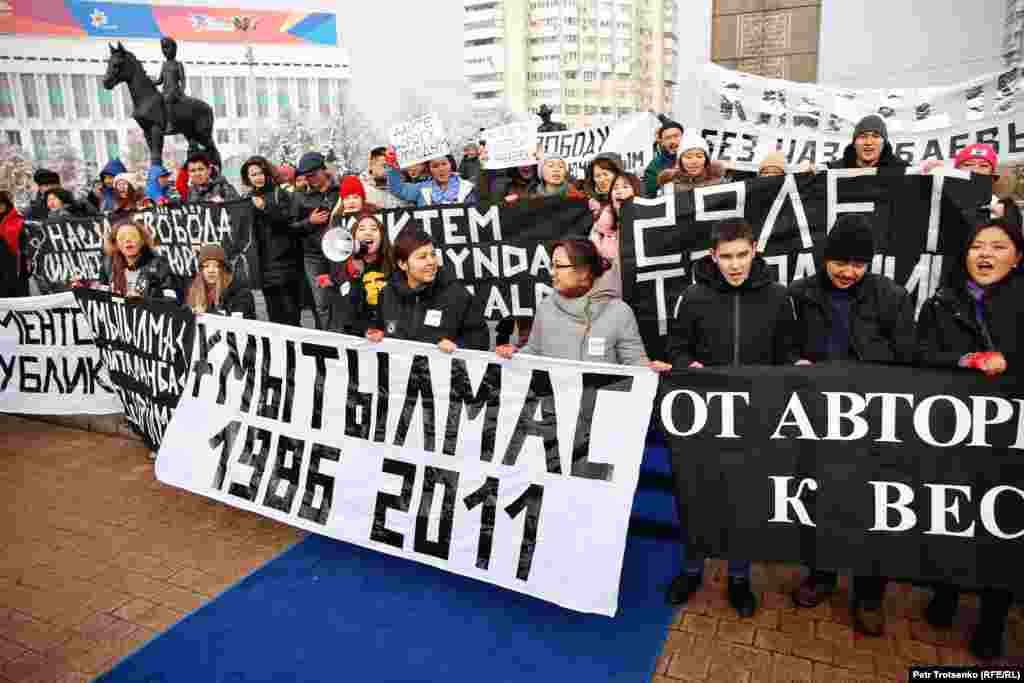 Activists of the youth movement Oyan, Qazaqstan (Wake Up, Kazakhstan) are seen at the Independence Monument in Almaty on December 16.