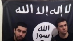 Кадр размещенной в Интернете видеозаписи, на которой запечатлены предполагаемые члены группировки "Ансар аль-Сунна", 20 января 2014 года. 