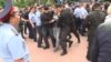 Kazakh police detain RFE/RL reporter Pyotr Trotsenko near the site of a protest against the presidential election in Almaty on June 9.