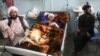 Afghan civilians injured in bomb blasts receive medical treatment at a hospital in Herat. 