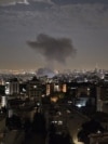 Smoke billowing from a site reportedly targeted by an Israeli strike in the Iranian capital Tehran early in the morning on June 13, 2025