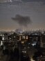 Smoke billowing from a site reportedly targeted by an Israeli strike in the Iranian capital Tehran early in the morning on June 13, 2025