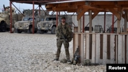 A soldier stands guard at Camp Shaheen in Mazar-e Sharif. (file photo)