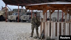 A soldier stands guard at Camp Shaheen in Mazar-e Sharif. (file photo)