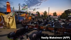 Ingush activists pray during an ongoing protest rally against the new land-swap deal with Chechnya in Magas last week.