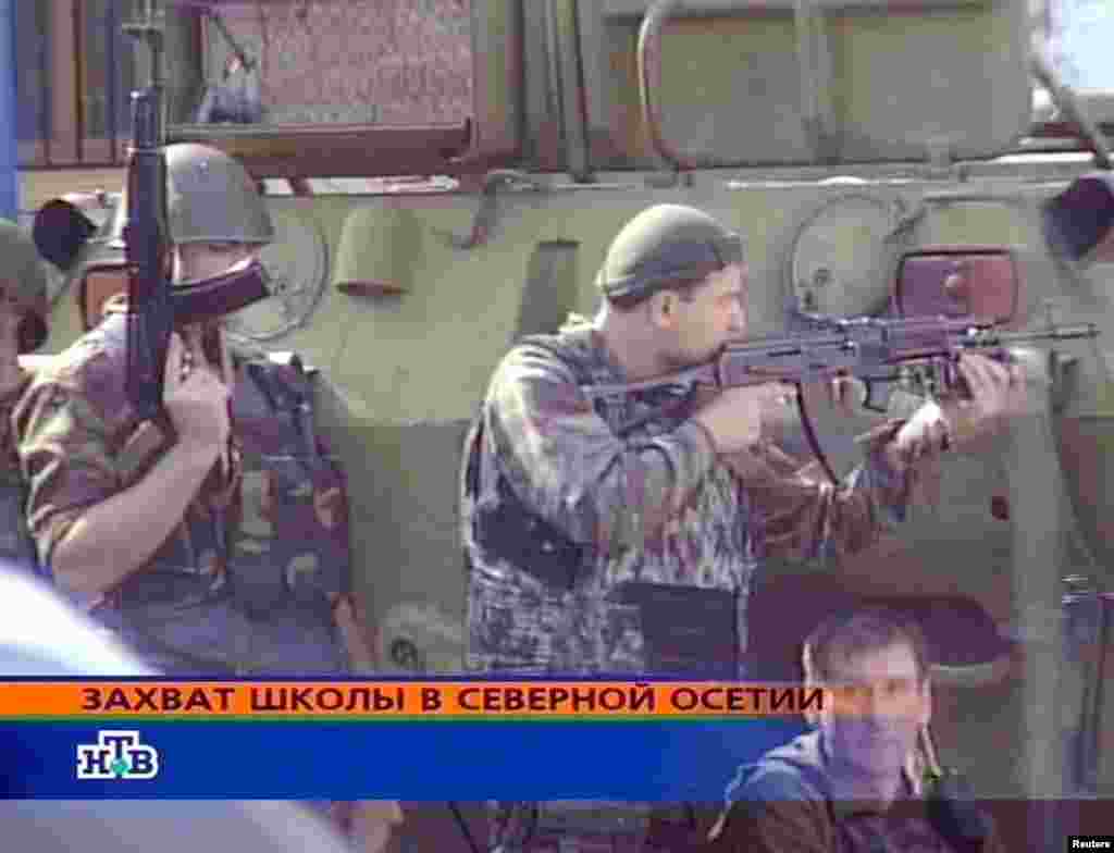 A screen grab from Russian NTV shows special forces soldiers outside the school.