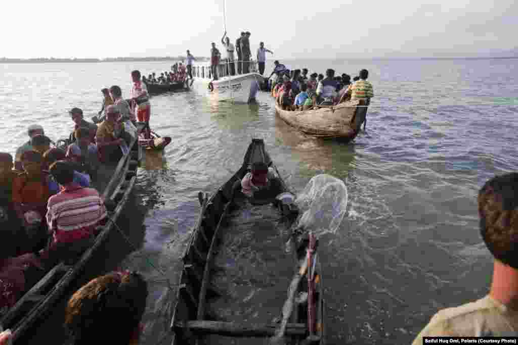 Crossing the river in wooden boats, the refugees are fleeing sectarian violence in western Burma. 