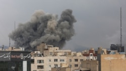 Smoke rises following an explosion in Tehran on March 2 amid ongoing strikes by the United States and Israel. 