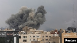 Smoke rises following an explosion in Tehran on March 2 amid ongoing strikes by the United States and Israel. 