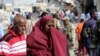Somali woman mourns at the scene of an explosion in Mogadishu