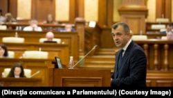 Ion Chicu addresses the parliament in Chisinau on November 14.