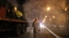 Iranian Firefighters disinfect streets in an effort to halt the spread of coronavirus in Tehran, March 11, 2020