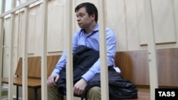 Konstantin Lebedev, an aide to opposition Left Front movement leader Sergei Udaltsov, sitting in the dock in a Moscow court in October 2012.