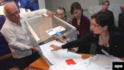 Local election commission members opening a ballot box at a polling station in Tbilisi after May 2008 voting.