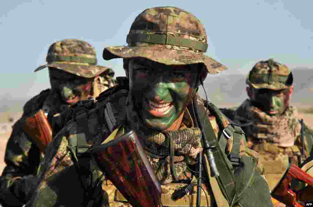 Soldiers with painted faces march during a military exercise at the Marshal Bagramian training grounds in Armenia near the border with Turkey on September 19. Around 2,000 troops from Armenia, Belarus, Kazakhstan, Kyrgyzstan, Russia, and Tajikistan held five days of exercises under the flag of the Collective Security Treaty Organisation (CSTO). (AFP/Karen Minasyan)