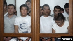 Осужденные по делу "о беспорядках в Жанаозене", Роза Тулетаева - справа в первом ряду. Актау, 4 июня 2012 года.
