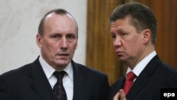 Naftogaz head Yevhen Bakulin (left, with Gazprom chief Aleksei Miller) is suspected of heading a "criminal group" whose members include other senior current and former Ukrainian government members.