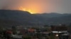 Explosions are seen over the mountains from Stepanakert, the main city of the breakaway Nagorno-Karabakh region, on October 30.