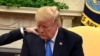 U.S. -- U.S. President Donald Trump closes his eyes in prayer along with Pastor Andrew Brunson, after his release from two years of Turkish detention, in the Oval Office of the White House, Washington, U.S., October 13, 2018. 