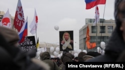 Opposition supporters at a December 24 rally in Moscow protest alleged violations in recent parliamentary elections and the policies of current Prime Minister Vladimir Putin.