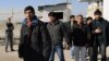 A group of Afghans leaves the airport following their deportation from France to Kabul. (file photo)
