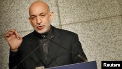 Afghan President Hamid Karzai delivers a speech during a seminar hosted by the Japan Institute of International Affairs in Tokyo on June 18.