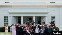 White House Press Secretary Leavitt speaks with reporters on the West Wing driveway at the White House in Washington