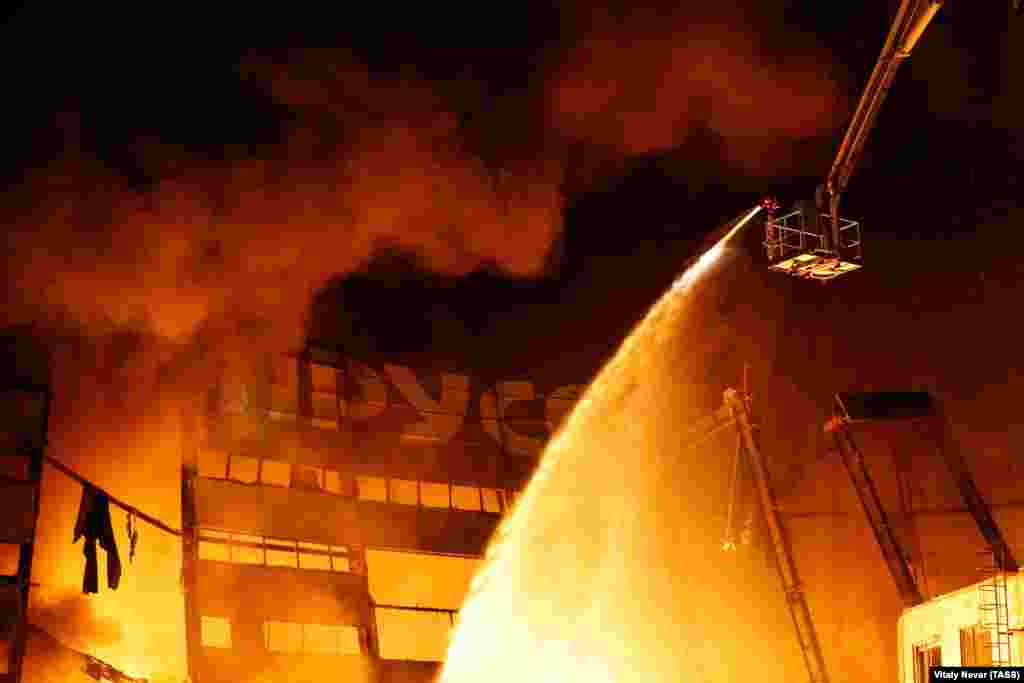 Russian firefighters battle a blaze at a former paper mill in Kaliningrad on April 1. (Vitaly Nevar/Tass)