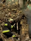 Ukraine - Kyiv - rescue workers search the rubble of an apartment building after a Russian strike - screen grab Current Time