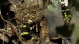 Ukraine - Kyiv - rescue workers search the rubble of an apartment building after a Russian strike - screen grab Current Time