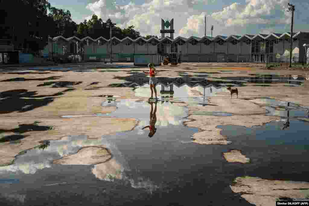 A woman rides her skateboard at the Sokolniki park in Moscow. (AFP/Dimitar Dikoff)