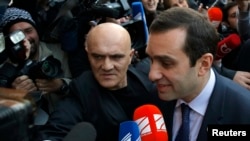 Defense Minister Irakli Alasania (right) was dismissed on November 4 after condemning arrests and charges against military officers as a politically motivated "attack on Georgia’s Euro-Atlantic choice."