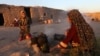 Afghan internally displaced civilians from Faryab province live in a temporary shelter on the outskirts of Herat, Afghanistan (file photo).