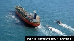 Boats from Iran's Islamic Revolutionary Guards Corps seize a South Korean-flagged tanker named Hankuk Chemi in the Persian Gulf on January 4.