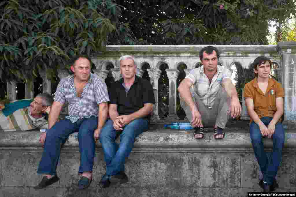 Men relax in Sukhumi. Precise statistics are not available, but locals claim unemployment reaches 80 percent in some parts of Abkhazia. 