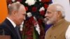 Russian President Vladimir Putin (left) and India's Prime Minister Narendra Modi shake hands after delivering a joint statement in New Delhi on October 5.