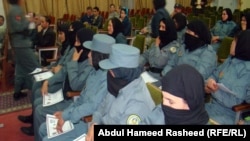 Afghan policewomen graduate from a training course. Militants frequently target women who work or study. Two senior female police officers were killed in the neighboring Helmand province earlier this year. (file photo)
