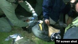 Boston Marathon bombing suspect Dzhokhar Tsarnaev lies injured as he is captured in Watertown, Massachusetts, on April 19.