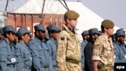 Afghan police and British NATO soldiers during a briefing at their military base in Lashkar Gah, Helmand Province, in February